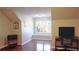 Bright office space with large window, natural light, and wood floors at 1104 Fox Ln, Woodstock, GA 30188