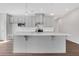 Spacious kitchen featuring a central island with light countertops and ample cabinetry with modern lighting fixtures at 1261 Burlington Ct, Mcdonough, GA 30253