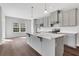 Bright kitchen with stainless steel appliances, gray cabinets, a large island, and a separate dining area filled with natural light at 1261 Burlington Ct, Mcdonough, GA 30253