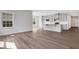 Open-concept living room and kitchen with lots of natural light and hardwood floors for modern living at 1261 Burlington Ct, Mcdonough, GA 30253