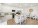 Bright kitchen features white cabinets, stainless appliances, granite countertops, and island with bar seating at 2015 Wyndham Pl, Conyers, GA 30013