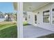Covered patio offers outdoor living with ceiling fan and view of the neighborhood at 2015 Wyndham Pl, Conyers, GA 30013