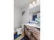 Well-lit bathroom featuring a vanity with dark cabinets at 693 Python Dr, Atlanta, GA 30349