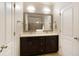 Bathroom with double sink vanity, framed mirror, and separate shower at 1365 Hawthorne Se Ave, Smyrna, GA 30080