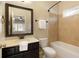 Traditional bathroom with a neutral color palette, vanity, and combination shower and tub at 1365 Hawthorne Se Ave, Smyrna, GA 30080