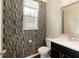 Stylish bathroom with modern fixtures, mosaic tile wall, and vanity at 1365 Hawthorne Se Ave, Smyrna, GA 30080