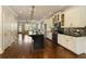 Open kitchen featuring stainless steel appliances, an island with bar seating, and hardwood floors at 1365 Hawthorne Se Ave, Smyrna, GA 30080