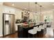Modern kitchen with a center island, pendant lighting, and stainless steel refrigerator at 1365 Hawthorne Se Ave, Smyrna, GA 30080