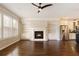 Bright and open living area with hardwood floors, a fireplace, built-in shelves, and stainless steel appliances at 1365 Hawthorne Se Ave, Smyrna, GA 30080