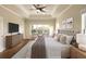This primary bedroom offers a fan, sitting area, and abundant light at 1365 Hawthorne Se Ave, Smyrna, GA 30080