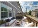Cozy outdoor patio with modern furniture, plants, and string lights at 1365 Hawthorne Se Ave, Smyrna, GA 30080