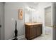 Bathroom featuring granite counters, a decorative mirror, and modern fixtures at 2865 Lenox Ne Rd # 410, Atlanta, GA 30324