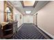 Hallway with elegant decor, patterned carpet, and a decorative chest at 2865 Lenox Ne Rd # 410, Atlanta, GA 30324