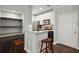 Modern kitchen with white cabinets, granite countertops, and bar seating at 2865 Lenox Ne Rd # 410, Atlanta, GA 30324