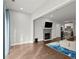 Bright living room with hardwood floors, fireplace, open to kitchen at 2865 Lenox Ne Rd # 410, Atlanta, GA 30324