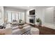 Bright living room with a fireplace, large window, plush seating, and a striped rug at 2865 Lenox Ne Rd # 410, Atlanta, GA 30324