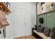 Charming entryway with decorative wall hooks, bench, and artwork adding unique character to the space at 309 Heavenly Hollow Pl, Mcdonough, GA 30253