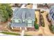 High-angle view of a two-story home featuring a well-kept lawn and manicured landscaping at 174 Kelly St, Norcross, GA 30071