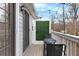 Balcony with a patio set, string lights, and a green screen for privacy at 384 Teal Ct, Roswell, GA 30076