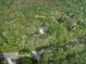 Aerial view of the property outlining the 7.12 acres of wooded land with a home at 4422 Fincher Rd, Canton, GA 30114