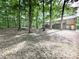 The backyard showcases a large deck with wooden stairs and dense trees at 4422 Fincher Rd, Canton, GA 30114
