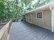 Expansive wood deck overlooking a private, wooded backyard and mature landscaping at 4422 Fincher Rd, Canton, GA 30114