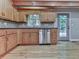 Bright kitchen with hardwood floors, a stainless steel dishwasher, and view of the backyard at 4422 Fincher Rd, Canton, GA 30114