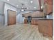 Open kitchen boasting abundant wood cabinetry, stainless steel appliances, and a mosaic backsplash at 4422 Fincher Rd, Canton, GA 30114