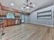Spacious open kitchen design with stainless steel appliances and hardwood floors at 4422 Fincher Rd, Canton, GA 30114