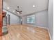 Open-concept living room with hardwood floors, recessed lighting, and a ceiling fan at 4422 Fincher Rd, Canton, GA 30114