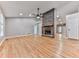 Spacious living room boasts hardwood floors, a stone fireplace and an open layout at 4422 Fincher Rd, Canton, GA 30114