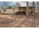 Exterior view of home with raised foundation and covered deck overlooking property at 90 Oak Ridge Dr, Carrollton, GA 30116