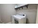 Modern laundry room with front-load washer and dryer and ample storage at 1037 Creek Side Dr, Canton, GA 30115