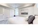 Cozy bedroom featuring light gray walls, light gray flooring, and a unique arched window at 2640 Harrington Dr, Decatur, GA 30033