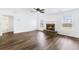 Spacious living room has a brick fireplace and natural light at 3259 Battlement Cir, Loganville, GA 30052