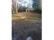 Spacious backyard featuring brick-paved area, shed, and mature landscaping at 5278 Madison St, Forest Park, GA 30297