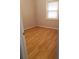 Cozy bedroom showcasing laminate floors and a bright window at 5278 Madison St, Forest Park, GA 30297