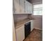Functional kitchen features white cabinetry, modern countertop, and a new dishwasher at 5278 Madison St, Forest Park, GA 30297