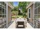 Cozy backyard space with an outdoor dining table with yard and playground views through the double french doors at 167 Freyer Ne Dr, Marietta, GA 30060