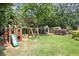 Spacious backyard with a playset and lush green grass, perfect for outdoor activities and Gathering fun at 167 Freyer Ne Dr, Marietta, GA 30060