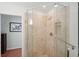 Luxurious bathroom showcasing a glass enclosed shower with travertine tile and chrome hardware at 167 Freyer Ne Dr, Marietta, GA 30060