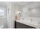 Updated bathroom boasting a dual sink vanity with marble countertop and a large framed mirror at 167 Freyer Ne Dr, Marietta, GA 30060