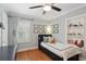 Delightful bedroom featuring hardwood floors, a storage bed, and a charming display shelf at 167 Freyer Ne Dr, Marietta, GA 30060