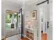 Bright foyer with hardwood floors, a stylish table, and views of the front porch through the open door at 167 Freyer Ne Dr, Marietta, GA 30060