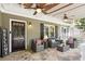 Inviting front porch with comfortable seating, ceiling fans, stone flooring and 'Welcome' sign at 167 Freyer Ne Dr, Marietta, GA 30060