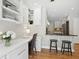 Office nook and breakfast bar overlooks the kitchen with stainless steel appliances and modern lighting at 167 Freyer Ne Dr, Marietta, GA 30060