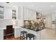 Kitchen with modern desk area features sleek countertops, white cabinets, stainless steel appliances, and breakfast bar at 167 Freyer Ne Dr, Marietta, GA 30060