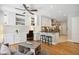 Stylish living area with breakfast bar features sleek countertops, white cabinets, hardwood floors, and lots of light at 167 Freyer Ne Dr, Marietta, GA 30060