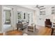 Bright living area with hardwood floors, built-in shelving, large windows, and door leading to the outdoors at 167 Freyer Ne Dr, Marietta, GA 30060