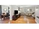 Bright living room with hardwood floors, a fireplace, and an open doorway to the dining room at 167 Freyer Ne Dr, Marietta, GA 30060